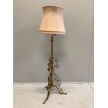 An early 20th century painted wrought iron telescopic standard lamp.