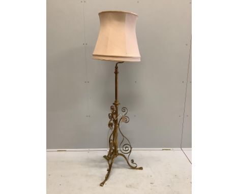An early 20th century painted wrought iron telescopic standard lamp.