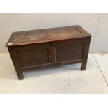 An 18th century panelled oak coffer, width 111cm, depth 47cm, height 62cm