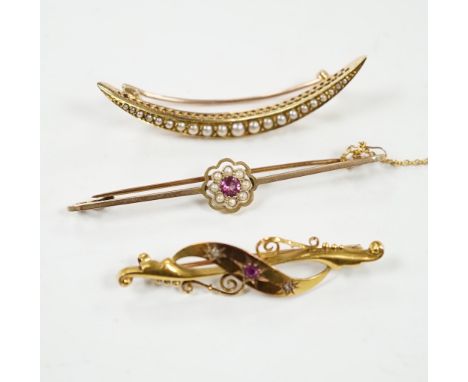 An Edwardian 15ct, ruby and diamond chip set three stone bar brooch, 45mm, a 9ct and gem set bar brooch and a yellow metal an