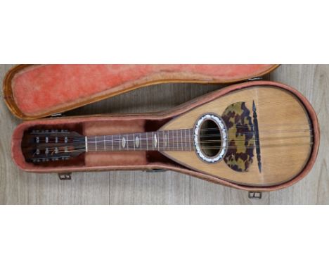 A cased Italian mandolin, labelled Domenico Maratea, and Fratelli Vinaccia, Naples, bowl backed body, length of body 30cm, wi