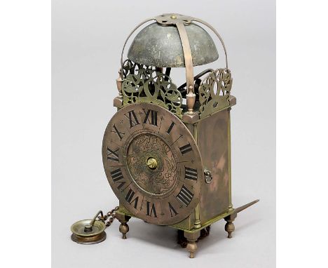 BRASS LANTERN CLOCK, the 6 1/2" dial on a brass movement striking to a bell, in a brass four column case with hook and spikes