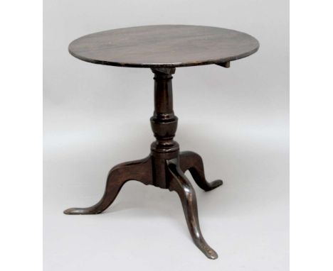 OAK OCCASIONAL TABLE, mid 18th century, the circular top on a baluster column and tripod base, height 68cm, diameter 70cm