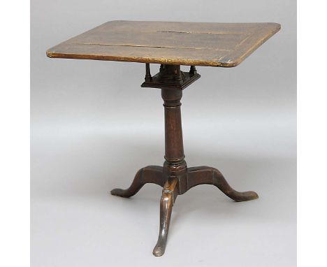 OAK RECTANGULAR OCCASIONAL TABLE, mid 18th century, the cleated top on a birdcage movement, turned column and tripod base, he