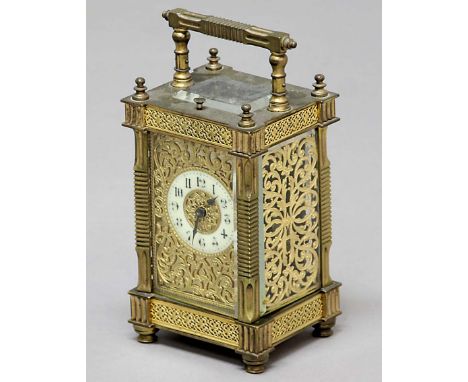 FRENCH GILT BRASS FOUR PANE CARRIAGE CLOCK, the ivorine dial inside a scrolling gilt frame, on an eight day movement, with re