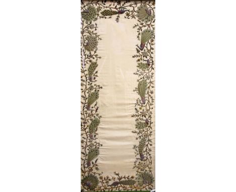 INDIAN EMBROIDERY, worked in silk and metal threads with a broad border of peacocks amongst meandering flowers on a light bei