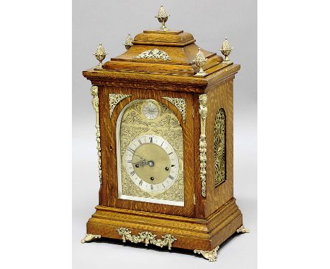 OAK BRACKET CLOCK, the 6 1/2" silvered chapter ring on a brass dial with star burst arch, on a brass, three train movement st