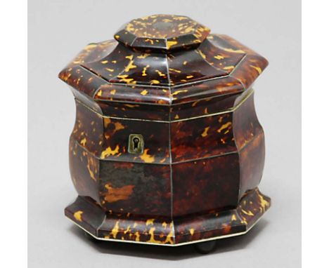 GEORGE III OCTAGONAL TEA CADDY,  of slightly swollen form, with twin canister interior, on metal ball feet, height15.5cm, dia