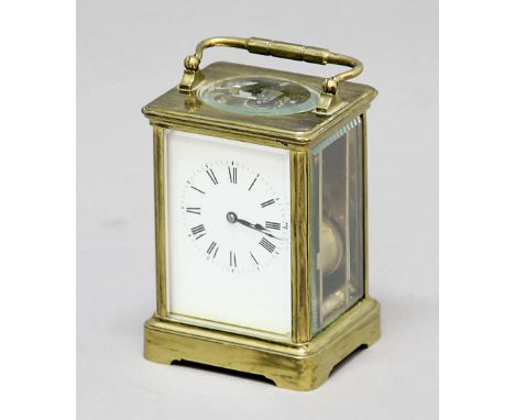 FRENCH BRASS FOUR PANE CARRIAGE CLOCK, the enamelled dial on a four pillar eight day movement half hourly striking to a gong,