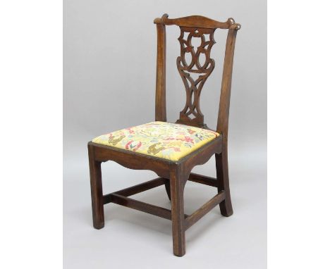 GEORGE III MAHOGANY DINING CHAIR, later 18th century in the Chippendale style, the scrolling top rail and supports above a pi