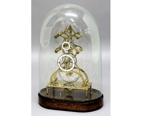 BRASS SKELETON CLOCK, the 4 1/2" enamelled chapter ring beneath a sudsidiary seconds dial on a chain driven single movement, 