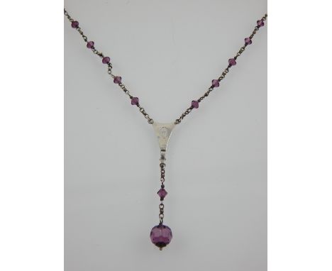 An Art Noveau style silver and amethyst beaded necklace. 