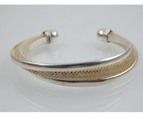 A silver bangle with central mesh design, 925