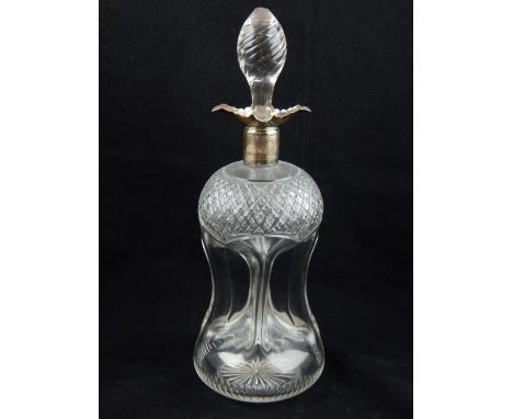 A silver topped glass decanter and stopper, Sheffield 1909 HW, the top with cross-hatched design above dimpled sides 