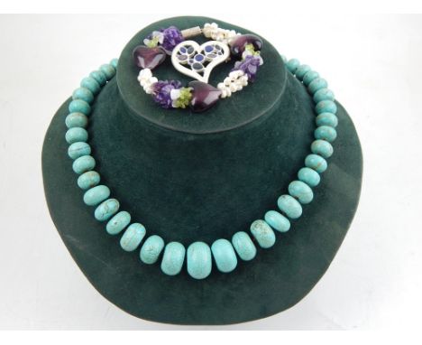 A turquoise beaded necklace, together with a pearl and amethyst bracelet and a white metal heart shaped brooch