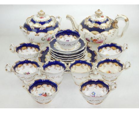 A mid 19th century Staffordshire part tea service, including a teapot, slop bowl, cup and saucers and a serving plate, (qty).
