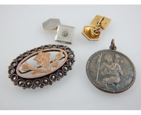 A pair of cufflinks, square with an engine turned plaque and set with a white stone, together with a gilt brooch and a silver