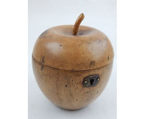 A fruitwood t caddy in the shape of an apple. 