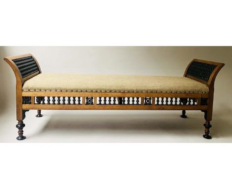 OTTOMAN DAYBED, 19th century Moorish hardwood, ebonised meshwork, turned supports and studded linen upholstery, 160cm x 52cm 