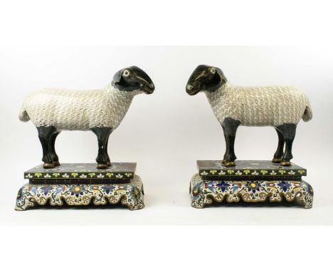 CLOISONNE ENAMEL SHEEP, late Qing Dynasty Chinese Republic period, a pair, on stands with Arabic inscription, 40cm H x 40cm W