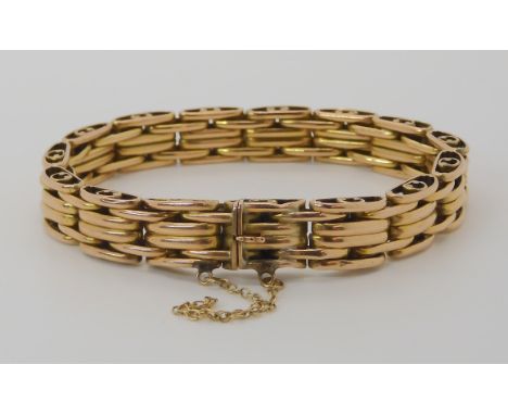 A 15CT GOLD FANCY GATE BRACELET length 17.5cm, weight 21.4gms Condition Report: A few very tiny dents, nothing dreadful, ligh