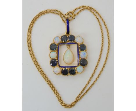 A GREEN SAPPHIRE AND OPAL PENDANT mounted in bright yellow metal, with a blue enamelled bail, length of the pendant 4cm inclu