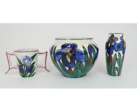 A ROBERT HERON AND SON WEMYSS WARE VASE painted with irises, with cartouche mark, 19.5cm high, a similar decorated planter 18