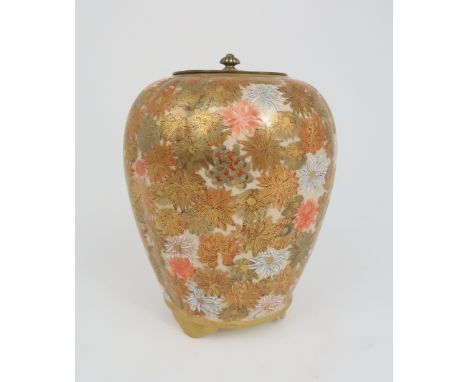 A SATSUMA LOBED POT POURRI VASE AND COVER painted all over with chrysanthemum, raised on three bracket feet and set with a pi