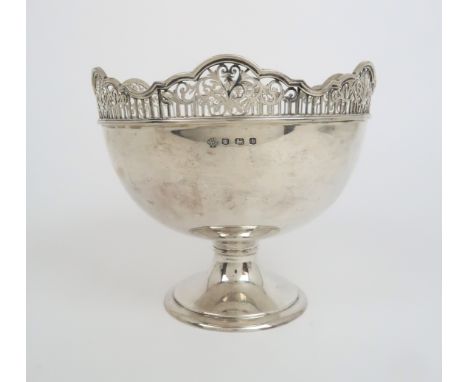A SILVER ROSE BOWL  by William Hutton &amp; Sons Sheffield 1926 of circular form the scalloped rim with pierced decoration on