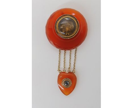 AN UNUSUAL CARNELIAN MOURNING BROOCH with heart shaped carnelian drop set with a rose cut diamond estimated to be approx 3.5m