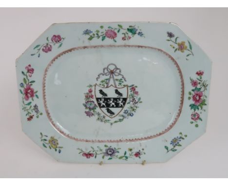 A CHINESE ARMORIAL OCTAGONAL ASHET painted with a central coat of arms within scattered flowers and divided by a gilt spearhe