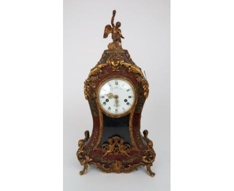 A FRENCH BOULLE MANTLE CLOCK with gilt metal mounts, the white enamel dial with Roman numerals, signed Gavelle Le á Paris, as