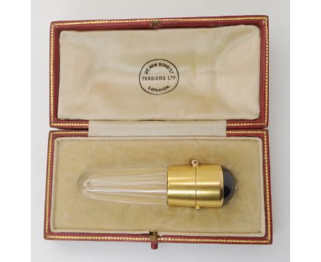 AN AUSTRIAN 14K GOLD ART DECO SCENT BOTTLE the glass flask mounted with 14k gold, and garnet domed cabochon and two diamonds 