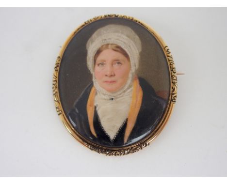 A PAINTED PORTRAIT MINIATURE OF A LADY bust length in white bonnet, in gilt-metal frame, 7 x 5cm Condition Report: Available 