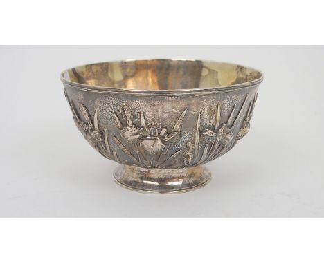 A CHINESE EXPORT SILVER BOWL decorated with irises on a hammered ground, inscription to the foot rim, dated 1911, hallmark to