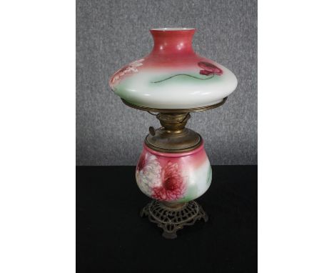 An early twentieth century hurricane lamp with hand painted floral decoration. Brass. H.53cm. 
