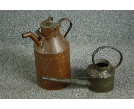 An nineteenth century copper milk churn with a metal watering can. The churn with some ageing and discolouration to the lid. 