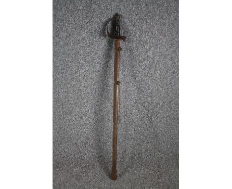 A sword and scabbard. Quite rusted and without a visible maker's mark. With a wooden handle and brass pommel. The blade is a 