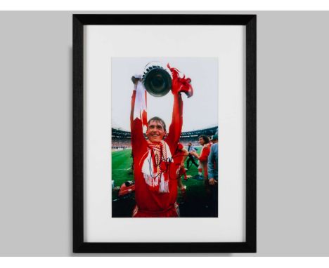 Kenny Dalgleish signed coloured photographic print, framed and glazed, measuring 17.5 x 13.5 ins, autographed in black pen. &
