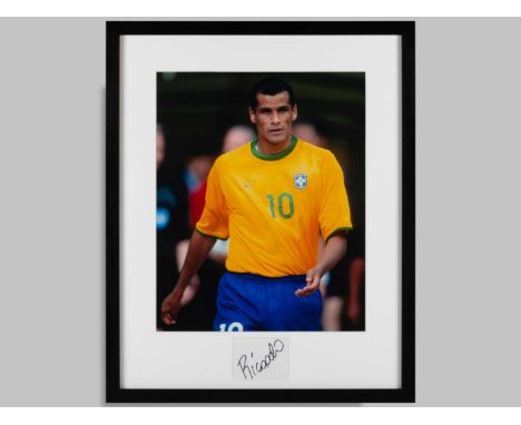 Rivaldo signed coloured photographic print, framed and glazed, measuring 21.5 x 17.5 ins, autographed in black pen. &nbsp;