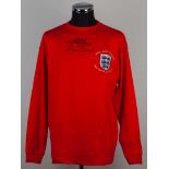 A red replica England Geoff Hurst and Martin Peters 50th Anniversary autographed shirt.