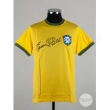 A replica yellow Pele autographed Brazil shirt.