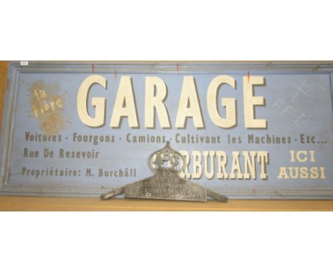 A replica vintage garage sign, and a cast alloy sign 'Garage, Astley, Brook & Co Ltd, Huddersfield'. (2)