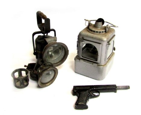 A Premier Lamp Company head lamp, paraffin lamp, cycle lamp and a Diana SP50 177 pistol. (4)