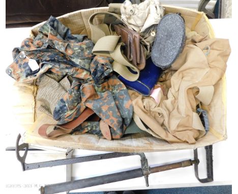 A selection of military items, to include Vickers 303 machine gun ammunition box, stirrup pump, straps, canteen, water bottle