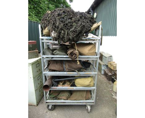 A quantity of tents, canvas bags, netting, light weight pegs, etc. (all on trolley) 