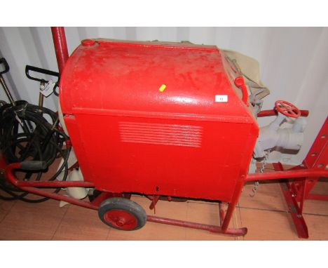 A vintage portable fire pump tender.