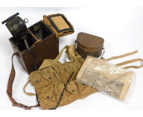 A World War I British signalling lamp, D shaped mess tin, and World War I American bandolier, etc. 
