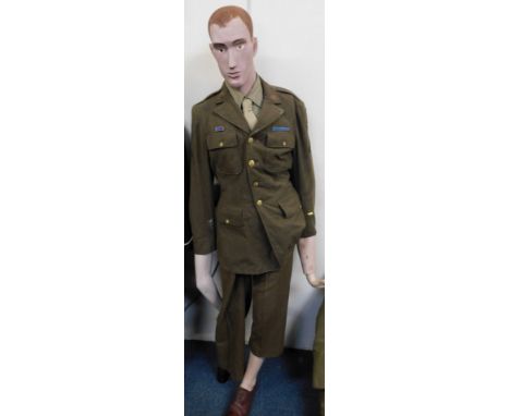 A male mannequin dressed in World War II US Army jacket and trousers. 