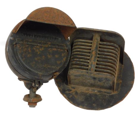 Two World War II black out car headlamp covers. 